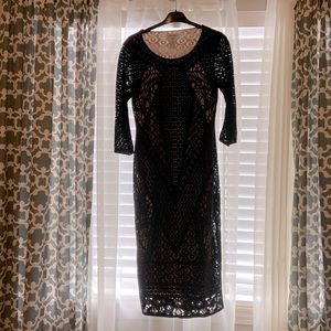 Black and nude colored pencil dress.